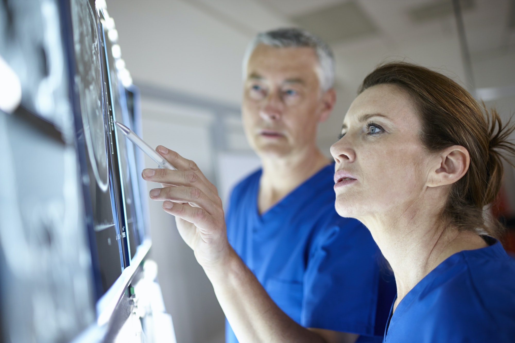 Radiologists looking at brain scans